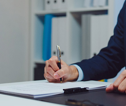 Signing an official bank check.