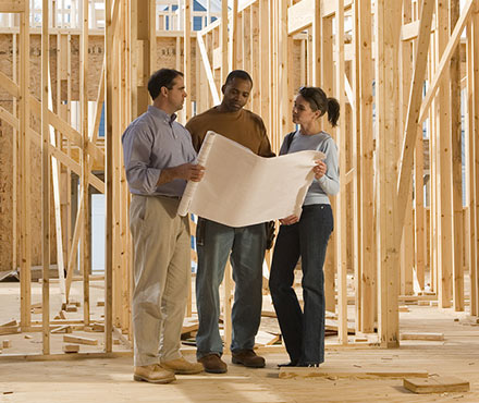 Couple looking at their home construction plans.