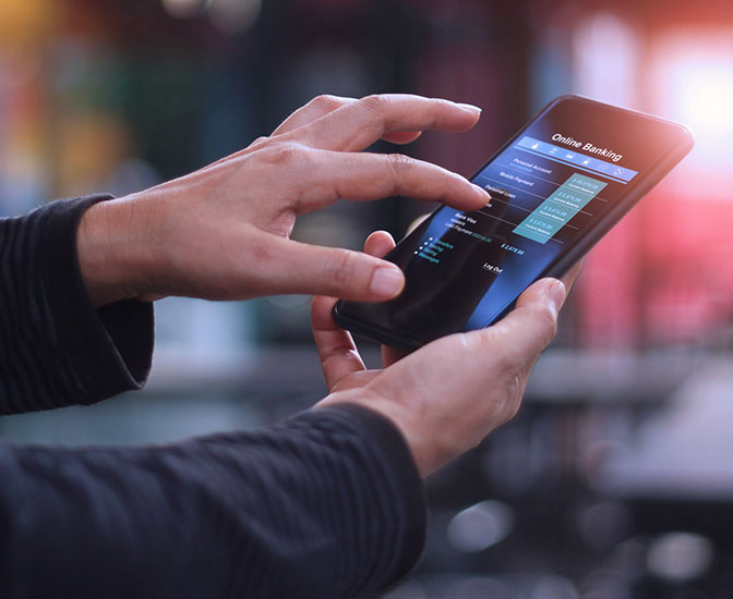 Person using their phone and mobile app to bank.