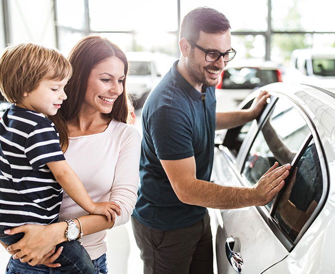 Family purchasing a new car.