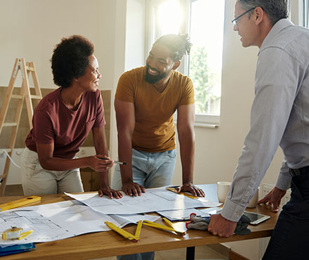 Couple looking over plans for their home improvement.